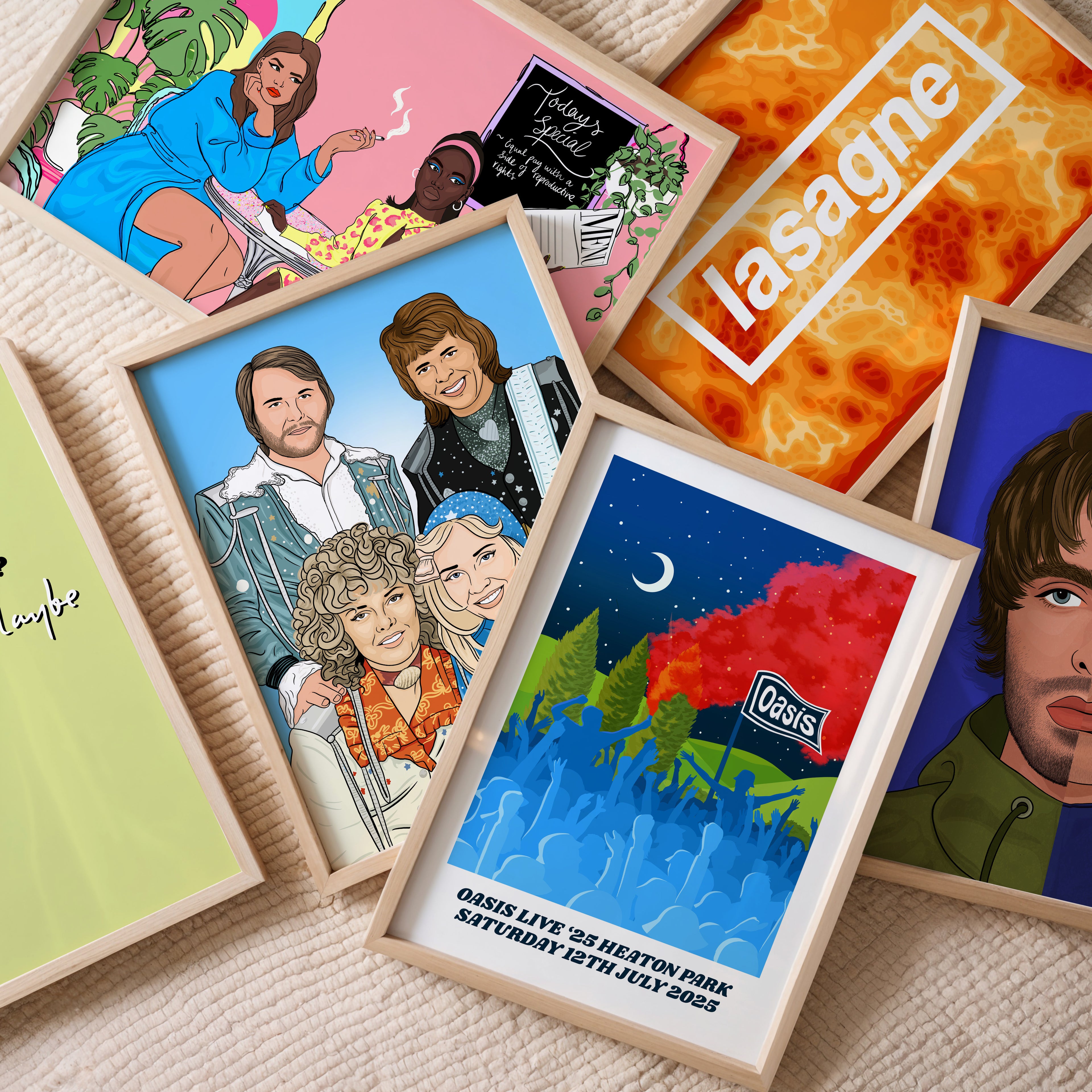 Collection of framed posters with various designs on a textured surface